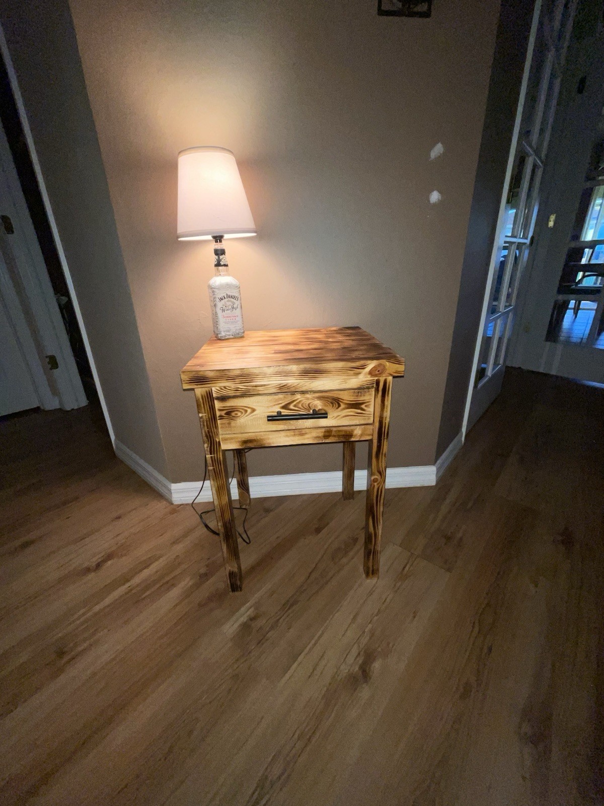 Nightstand/ end table. Has three coats of polyurethane. Wood burn finish.