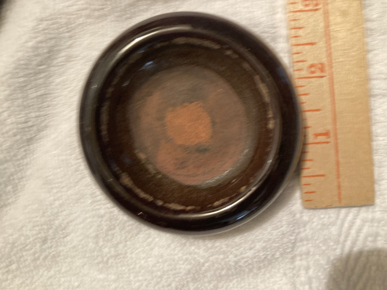 Vintage Ceramic furniture caster cup, which is a type of floor protector.