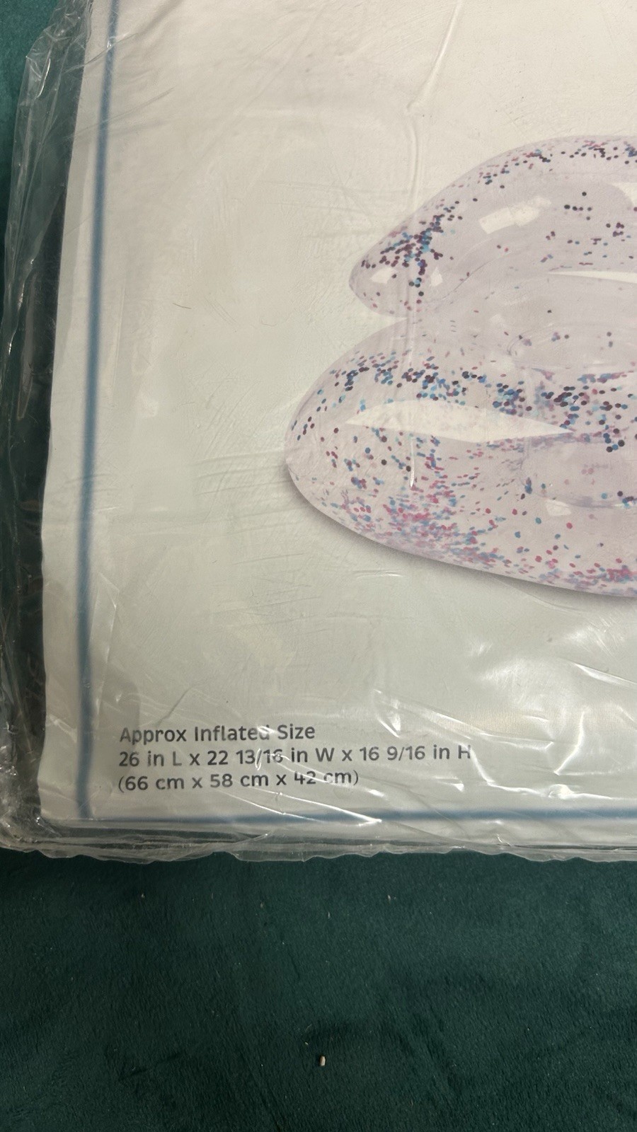 inflatable chair with transparent glitter, in the style of the 90s or 2000s.