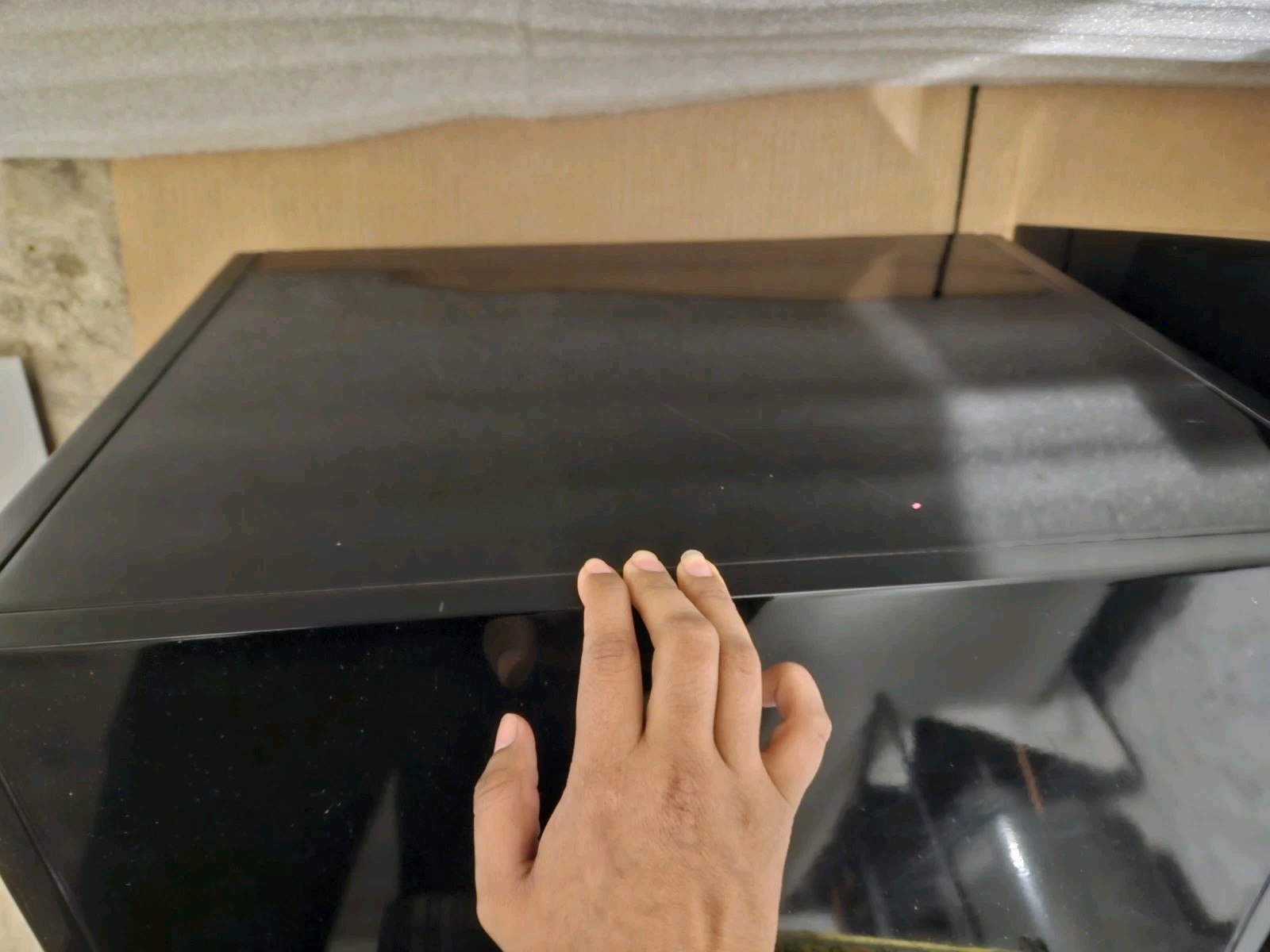Two modern, functional two-drawer nightstands with a high-gloss black finish.