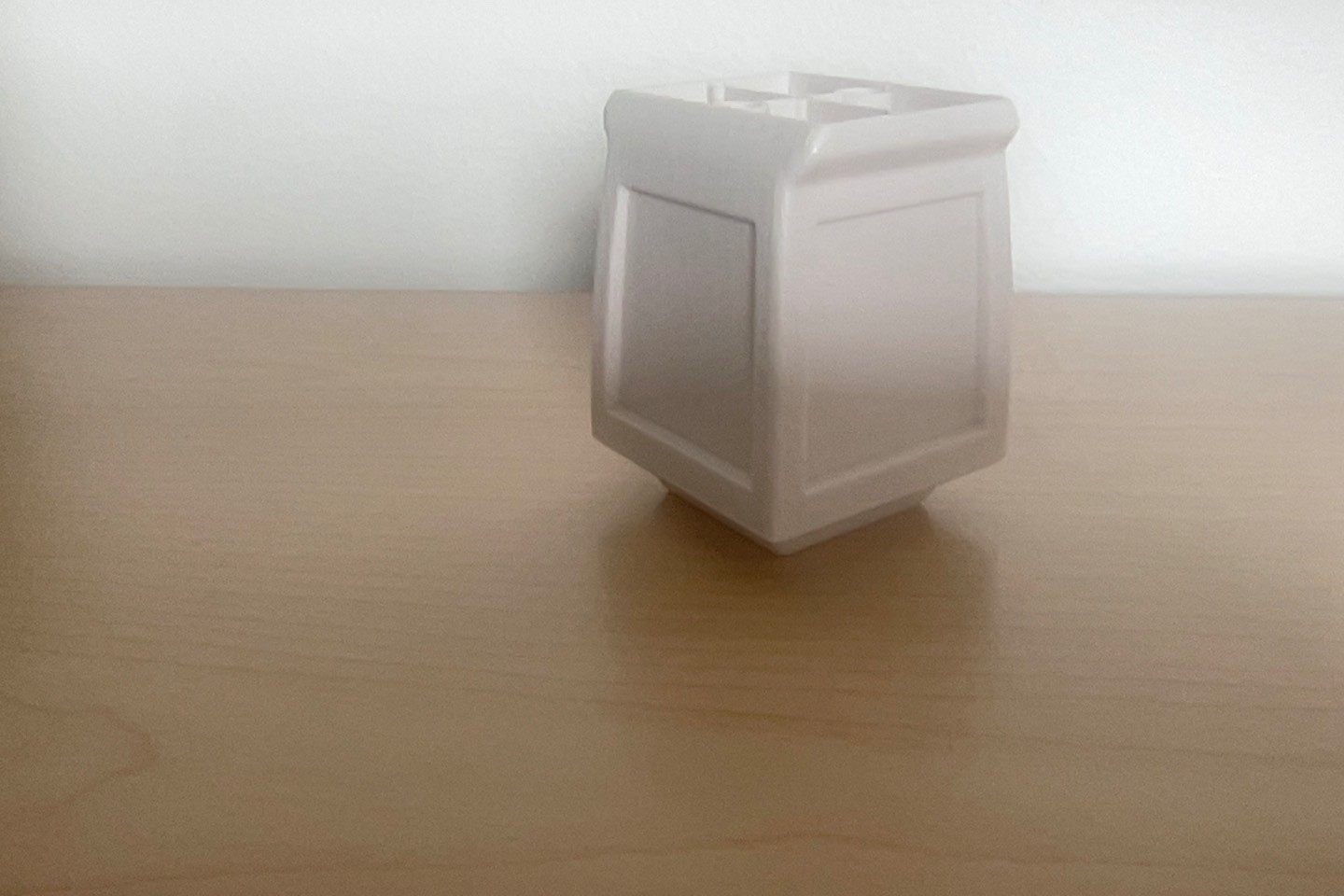 Off white plastic furniture legs. Square (cube) shape. 3.5 inches hi. 2.5 wid