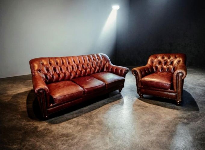 Elevate your space with A timeless Chesterfield Sofa and Matching Club Chair Set