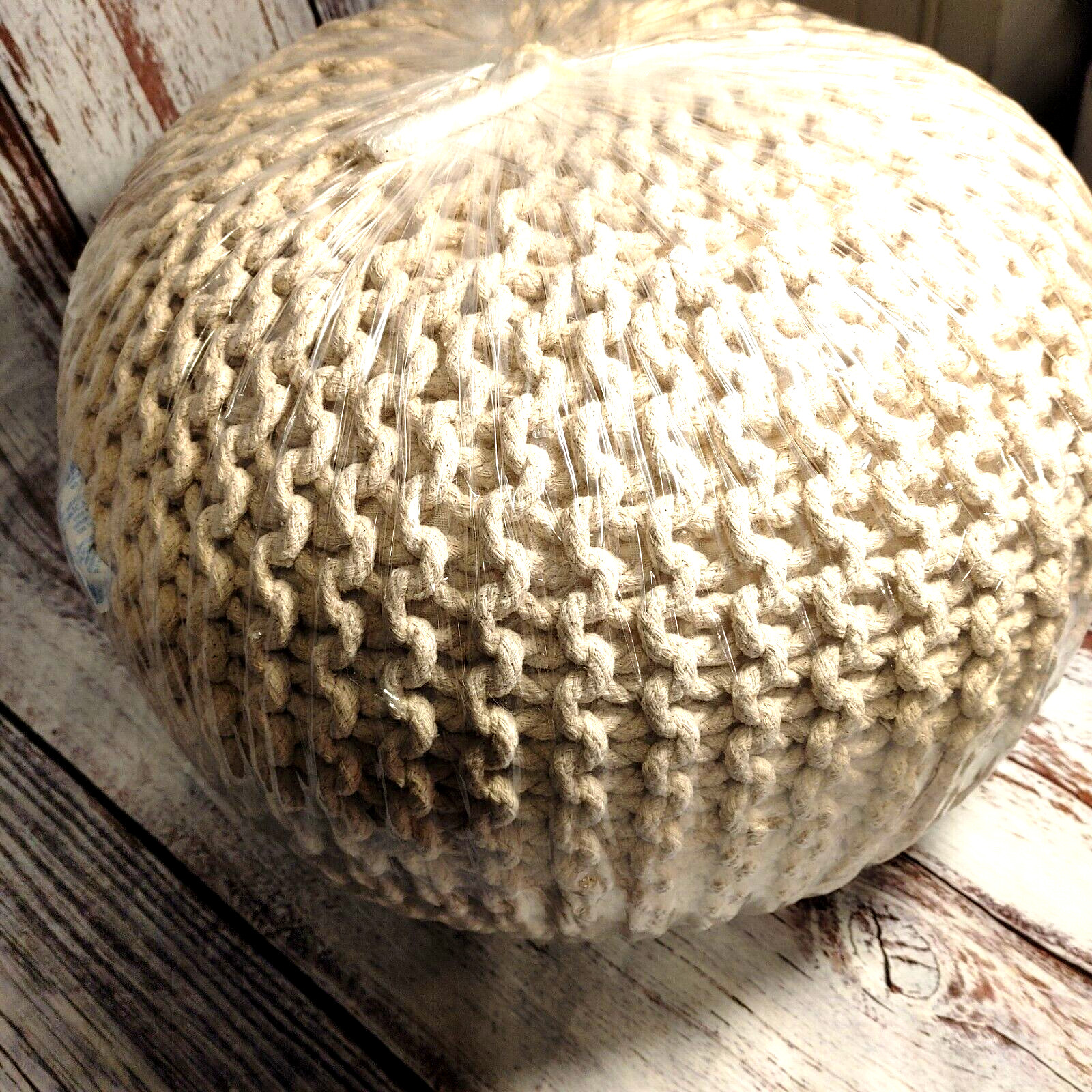 Foot Spool, braided rope, firm, tan, filled with 100% poly, covered 100% cotton.