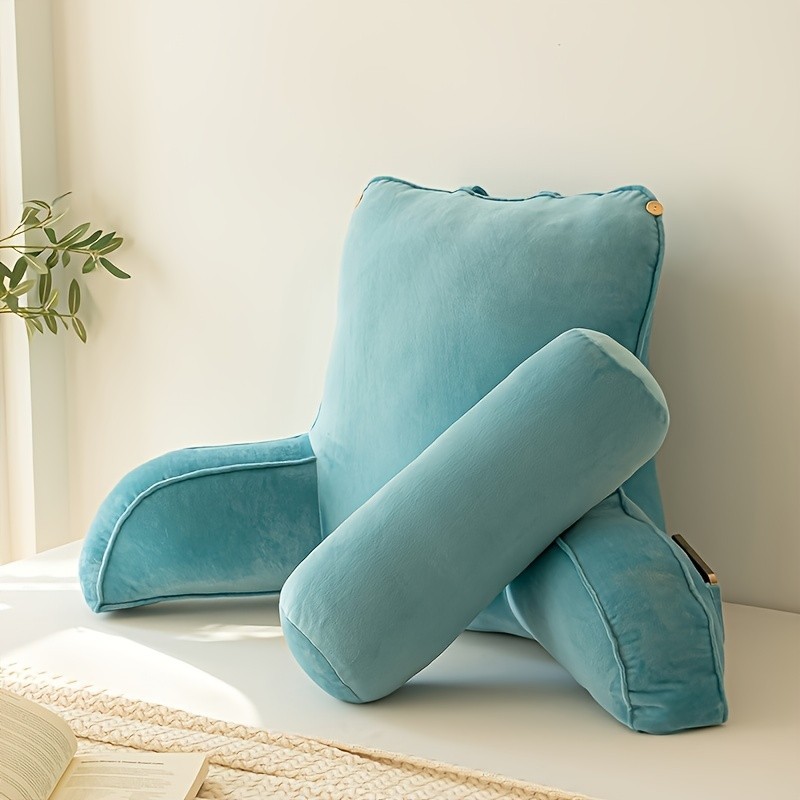 The reading pillow has a waist support, an armrest, and a neck support.